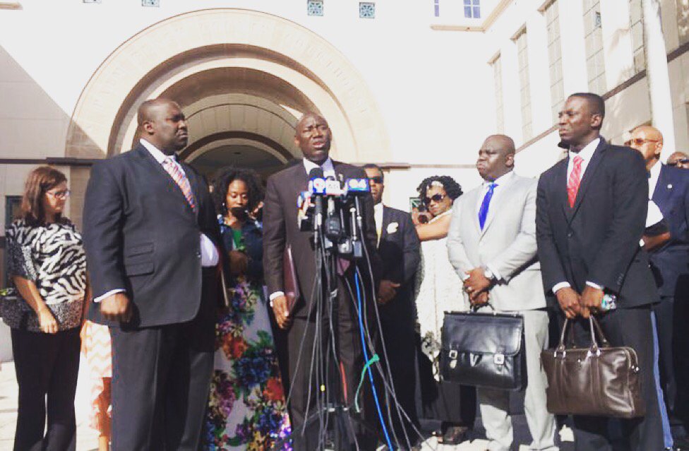 Attorneys Daryl Parks, Benjamin Crump, Skinner Louis and Kweku Darfoor at a press conference outside a courthouse for the family of Corey Jones