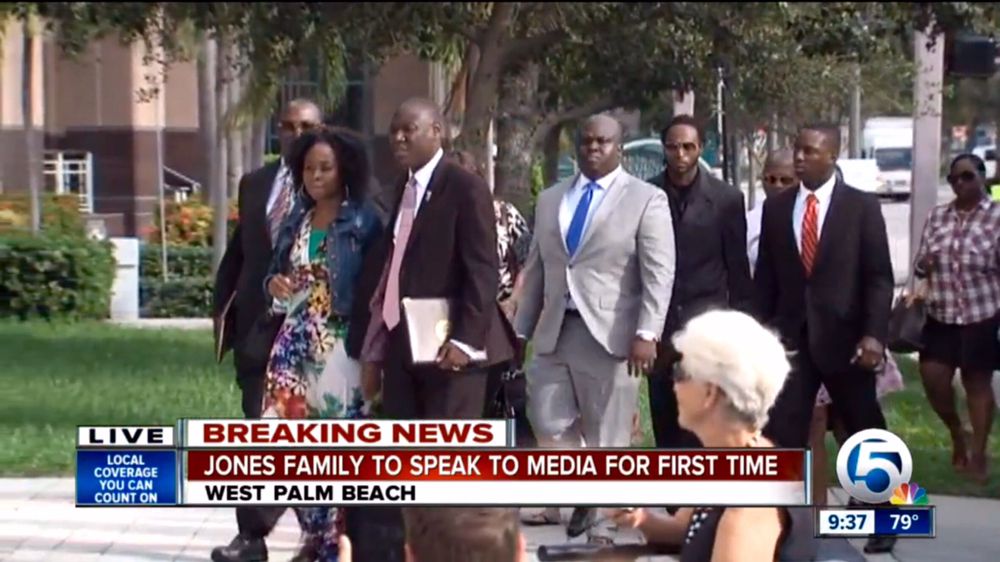 Attorneys for the Jones family walking with Corey Jones’ brother and sister in West Palm Beach